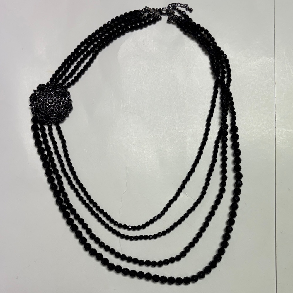 Black Beaded Necklace with four Strands and brooch